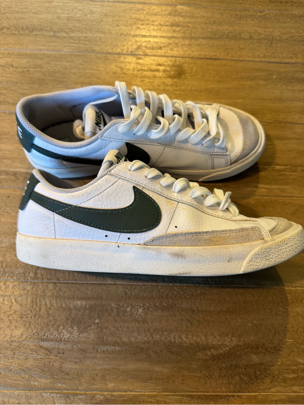 Nike White Low-Top Sneakers with Dark Green Swoosh